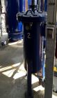 Used Quincy Air Treatment Unit. Industrial compressed-air vessel, identified as Unit 3, is a vertical steel separator/filter housing designed for inline air-treatment service within a multi-compresso...
