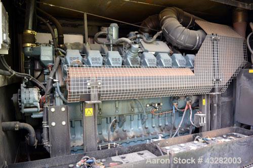 Used Atlas Copco QAC 1006 Package, DDC/MTU, 1000kW standby (900kW prime) portable diesel generator set. DDC/MTU model 16V2000 R163-7K37, EPA Tier 1, four-stroke diesel engine. Mecc-Alte Model ECO 43-...