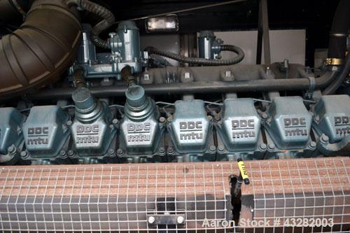 Used Atlas Copco QAC 1006 Package, DDC/MTU, 1000kW standby (900kW prime) portable diesel generator set. DDC/MTU model 16V2000 R163-7K37, EPA Tier 1, four-stroke diesel engine. Mecc-Alte Model ECO 43-...