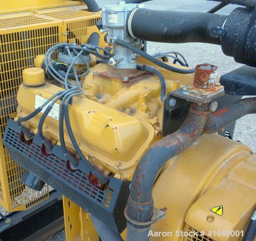 Used CAT/Olympian 60 kW Natural Gas Generator Set, Model G60F1, Serial #E0519A/001. Ford Motor Co natural gas engine, model WSG1068, V10. 3/60/120/240V. Hours 255, year 1999.