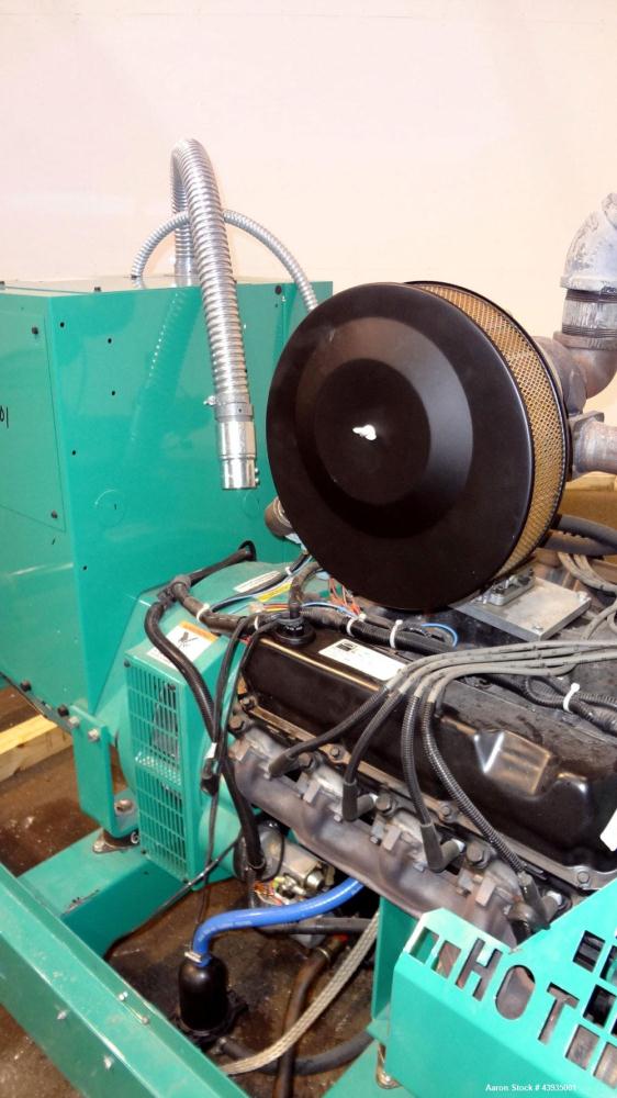 Used Cummins / Onan 80 kW Standby Natural Gas Generator Set, Model 80GGHC-67, Serial E990909239. Ford LSG-875I-6005-A engine, serial 13606-1-04-98. 3/60/277/480. 150 Amp mainline circuit breaker. Coo...