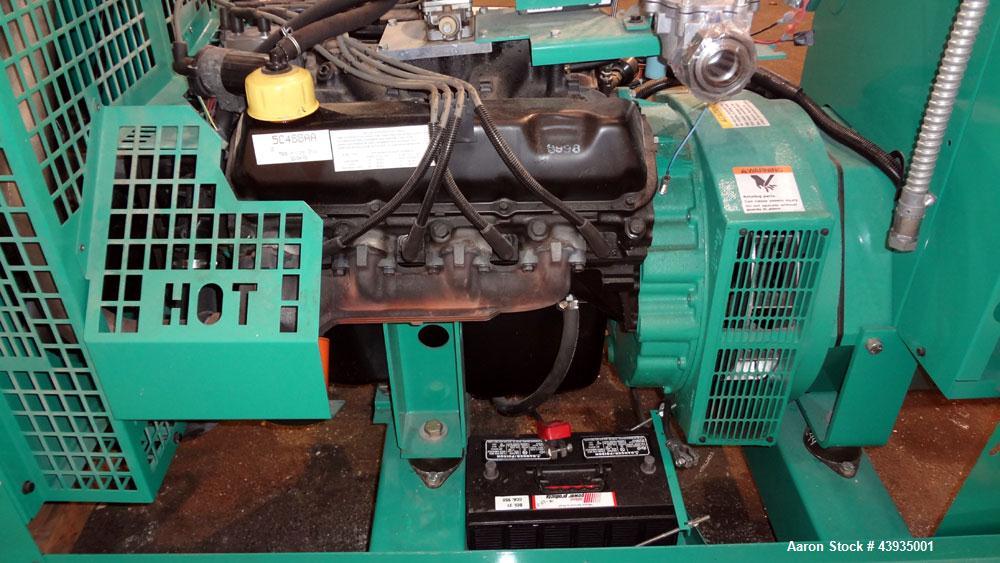 Used Cummins / Onan 80 kW Standby Natural Gas Generator Set, Model 80GGHC-67, Serial E990909239. Ford LSG-875I-6005-A engine, serial 13606-1-04-98. 3/60/277/480. 150 Amp mainline circuit breaker. Coo...