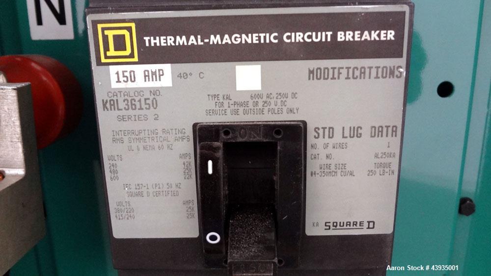 Used Cummins / Onan 80 kW Standby Natural Gas Generator Set, Model 80GGHC-67, Serial E990909239. Ford LSG-875I-6005-A engine, serial 13606-1-04-98. 3/60/277/480. 150 Amp mainline circuit breaker. Coo...