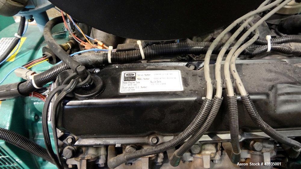 Used Cummins / Onan 80 kW Standby Natural Gas Generator Set, Model 80GGHC-67, Serial E990909239. Ford LSG-875I-6005-A engine, serial 13606-1-04-98. 3/60/277/480. 150 Amp mainline circuit breaker. Coo...
