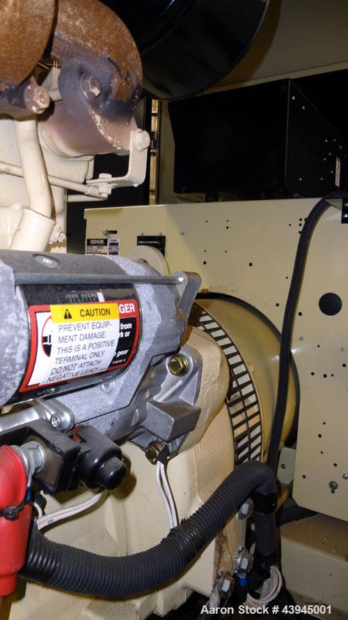 Used Kohler 62 kW standby diesel generator set, model 60REOZJB, SN-2104402. John Deere 4045T150 engine rated 110 HP @ 1800 RPM, emissions EPA tier 2 certified. 3/60/120/240V with PMG permanent magnet...