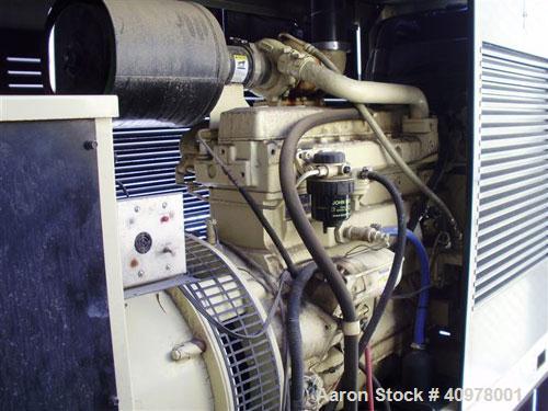 Used Kohler 80 kW diesel generator set, model 80REOZ. 3/60/277-480V. Includes Asco ATS, battery charger, block heater, weather enclosure, muffler and sub-base fuel tank. 51 hours. Year 2000.