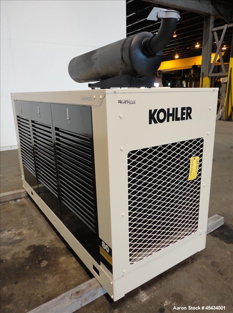 Used Kohler 80 kW Standby Natural Gas Generator Set, Model 80RZ72, Serial #388591. Ford LSG 875 engine rated 132 hp @ 1800 rpm, serial #07533 A-04-RH. 3/60/480V. Mainline circuit breaker. Coolant hea...