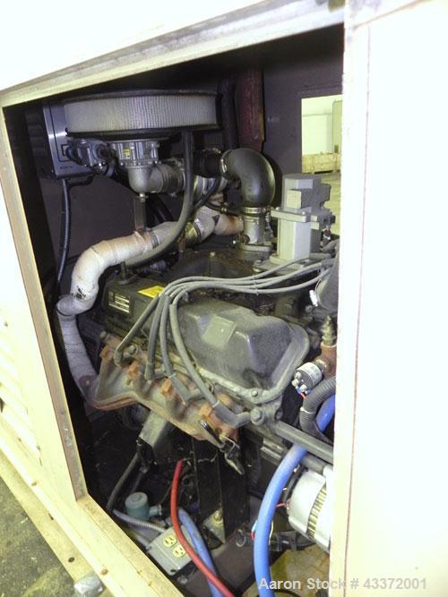 Used Magnetek 100 kW standby natural gas generator set, model RNS 1250 SN-PM078611. Ford model LSG-8751-6007-ZA engine SN-04053 L-28-RA. 3/60/208/240/480V or 1/60/120/240V. Main-line circuit breaker....