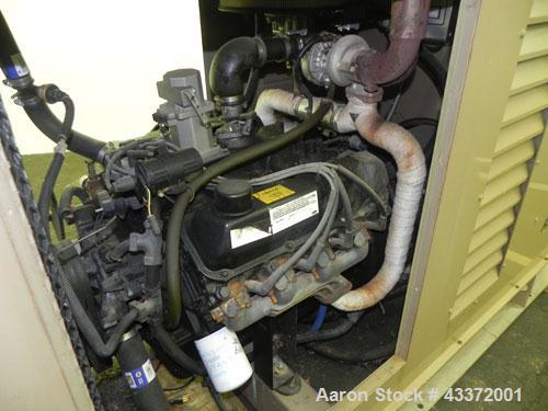 Used Magnetek 100 kW standby natural gas generator set, model RNS 1250 SN-PM078611. Ford model LSG-8751-6007-ZA engine SN-04053 L-28-RA. 3/60/208/240/480V or 1/60/120/240V. Main-line circuit breaker....