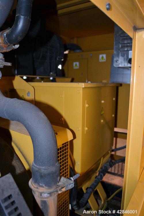 Used CAT / Olympian 100 kW natural gas generator set, model G100F1 SN- E4640A/001. 3/60/120/208V. 400 Amp main-line circuit breaker. Weather Enclosure.195 hours. Year 1999.