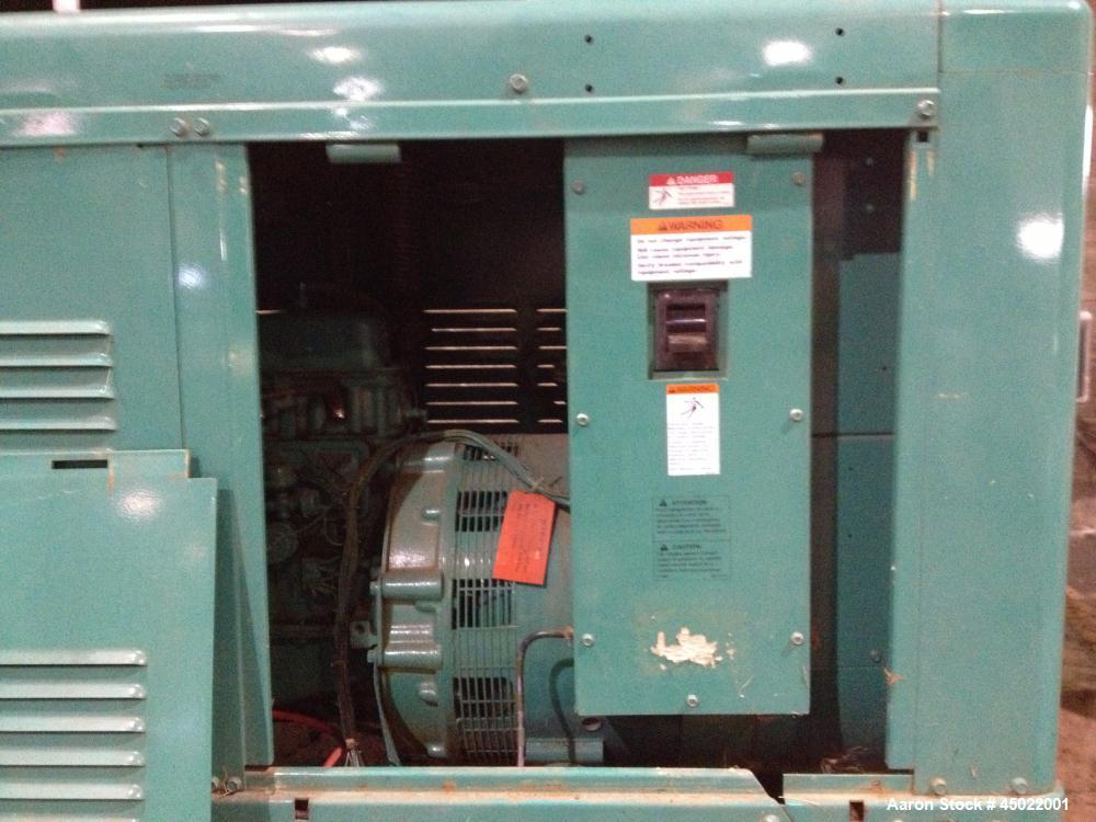 Used Onan Backup Generator, 45 kw, transfer switch 225A, heavy duty Ford 6 cyl engine CSG-6491-6005, in outdoor enclosure, set for propane, manufactured 1990.