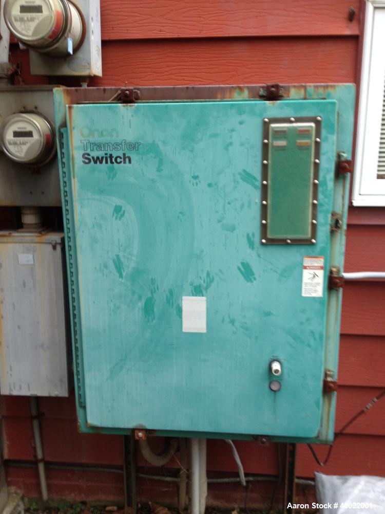 Used Onan Backup Generator, 45 kw, transfer switch 225A, heavy duty Ford 6 cyl engine CSG-6491-6005, in outdoor enclosure, set for propane, manufactured 1990.