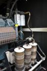 Used Atlas Copco QAC 1006 Package, DDC/MTU, 1000kW standby (900kW prime) portable diesel generator set. DDC/MTU model 16V2000 R163-7K37, EPA Tier 1, four-stroke diesel engine. Mecc-Alte Model ECO 43-...