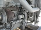 Used Detroit Diesel / Spectrum 150 kW standby generator set. Model 150DS60 SN-387426. 3/60/277/480V.Main-line curcuit breaker. Battery charger, block heater, sub-base fuel tank, muffler. 275Hrs,
