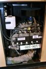 Used Generac 150 kW Natural Gas Generator Set, Model QT15068ANSN SN-4842574, Ford model WSG1068 SN-07VS65939. 1/120/240V. 700 Amp main-line circuit breaker. Weather Enclosure, Year 2007, 0 Hours