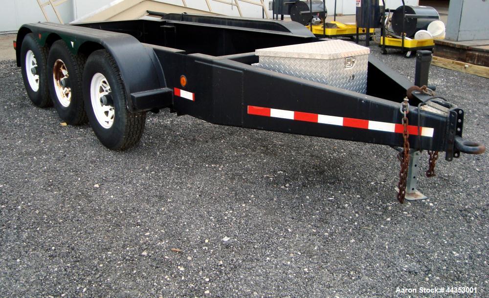 Used- Quality Welding Service 21,000 lb triple axle generator trailer with no fuel tank. New in 1999.