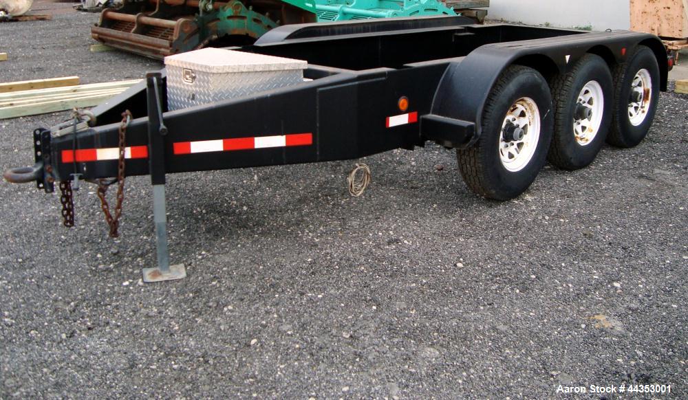 Used- Quality Welding Service 21,000 lb triple axle generator trailer with no fuel tank. New in 1999.
