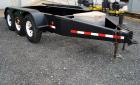 Used Quality Welding Service 21,000 lb triple axle generator trailer with no fuel tank. New in 1999.