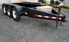 Used- Quality Welding Service 21,000 lb triple axle generator trailer with no fuel tank. New in 1999.