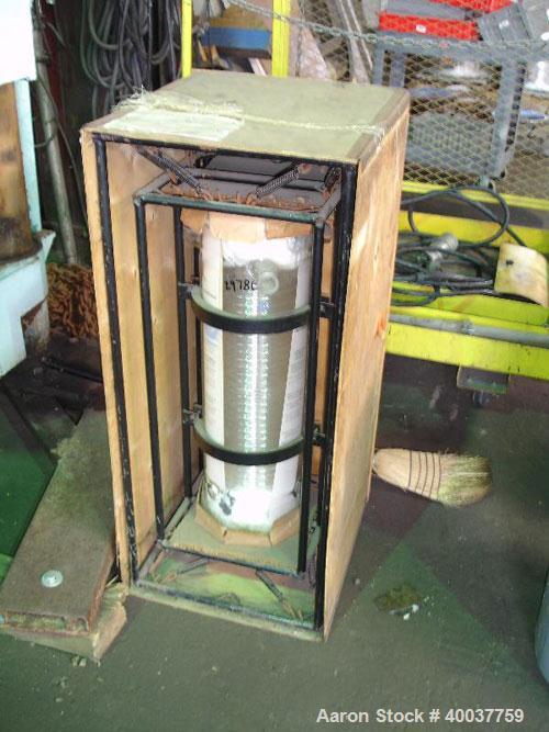 Unused- QVC Coil Condenser, Model HE9, 25 square feet. Glass construction, coil tube rated 40 psi at 300 degrees F, shell rated 11 psi at 300 degrees F, approximately 225 mm shell diameter, 5.3 gallo...