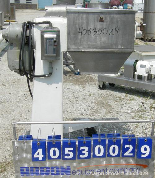 Used Colton Twin Shaft Oscillating Granulator, 304 stainless steel. (2) 5" diameter x 19" long 6 blade rotors. Top cover with feed opening, safety grate, bottom discharge chute, requires screen. Driv...