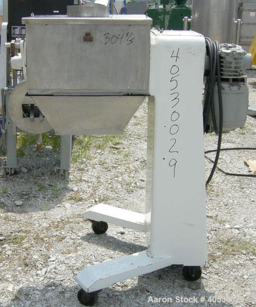 Used Colton Twin Shaft Oscillating Granulator, 304 stainless steel. (2) 5" diameter x 19" long 6 blade rotors. Top cover with feed opening, safety grate, bottom discharge chute, requires screen. Driv...