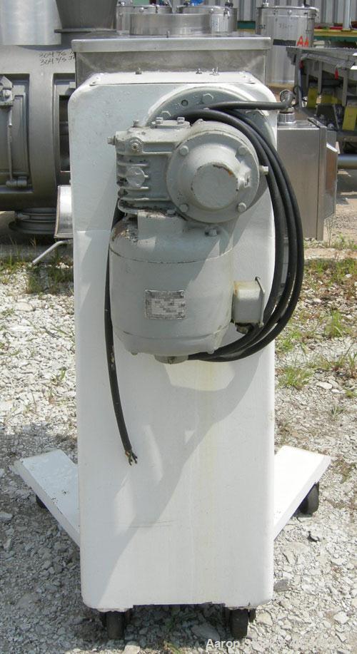 Used Colton Twin Shaft Oscillating Granulator, 304 stainless steel. (2) 5" diameter x 19" long 6 blade rotors. Top cover with feed opening, safety grate, bottom discharge chute, requires screen. Driv...
