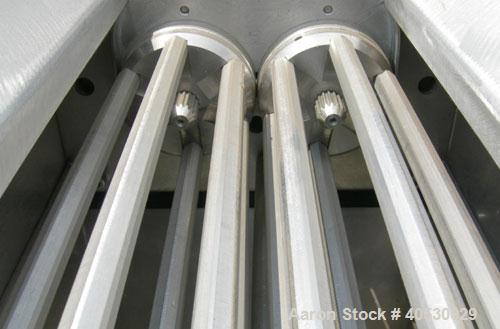 Used Colton Twin Shaft Oscillating Granulator, 304 stainless steel. (2) 5" diameter x 19" long 6 blade rotors. Top cover with feed opening, safety grate, bottom discharge chute, requires screen. Driv...