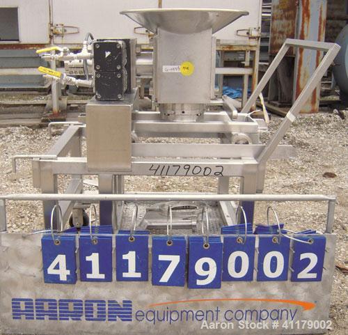 Used Oscillating Granulator, 316 Stainless Steel. 5" diameter, air operated rotor.  6 1/4" top inlet, 2 1/4" bottom outlet with hand operated valve. Includes screens.  Mounted on a portable stainless...