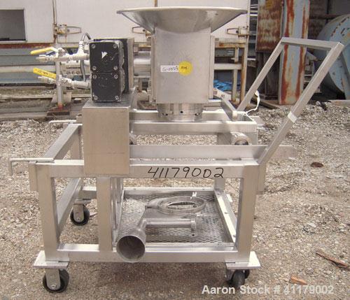 Used Oscillating Granulator, 316 Stainless Steel. 5" diameter, air operated rotor.  6 1/4" top inlet, 2 1/4" bottom outlet with hand operated valve. Includes screens.  Mounted on a portable stainless...