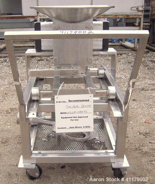 Used Oscillating Granulator, 316 Stainless Steel. 5" diameter, air operated rotor.  6 1/4" top inlet, 2 1/4" bottom outlet with hand operated valve. Includes screens.  Mounted on a portable stainless...