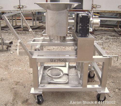 Used Oscillating Granulator, 316 Stainless Steel. 5" diameter, air operated rotor.  6 1/4" top inlet, 2 1/4" bottom outlet with hand operated valve. Includes screens.  Mounted on a portable stainless...