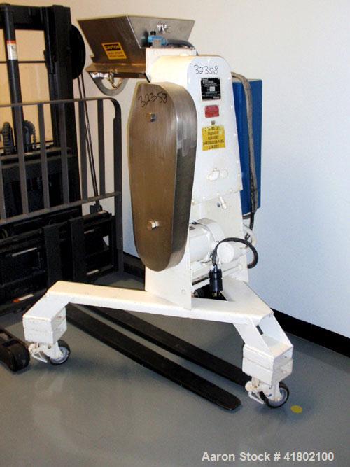 Used Stokes Oscillating Granulator, Model 900-43-6,Stainless Steel. Top feed opening with hopper. Driven by an approximate 1 hp motor. Mounted on a carbon steel base with casters.