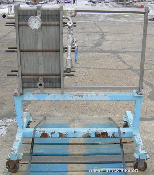 USED: Plate heat exchanger, approximately 40 square feet, 316 stainless steel. 2 sections, (92) approximately 2-3/4" wide x ...