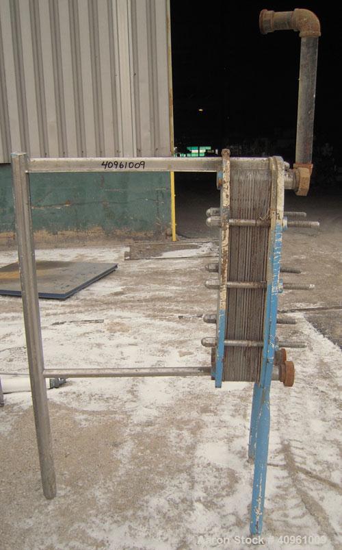 Used- APV Plate Heat Exchanger, Type HXL(6), 317 stainless steel. Approximately 61 square feet. (31) approximate 8" wide x 3...