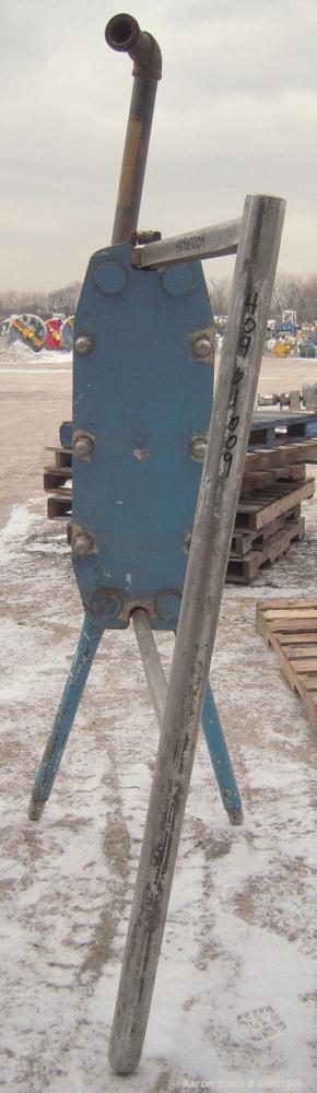 Used APV Plate Heat Exchanger, Type HXL(6), 317 stainless steel. Approximately 61 square feet. (31) approximate 8" wide x 32" long plates. 2" inlet/outlet. Expandable stainless steel frame.