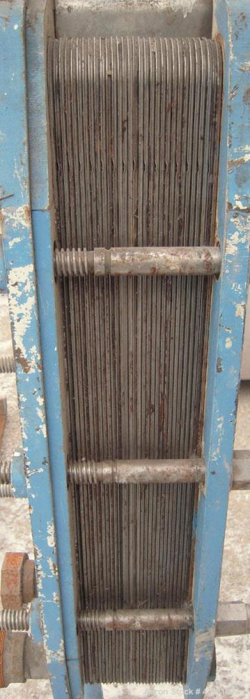 Used APV Plate Heat Exchanger, Type HXL(6), 317 stainless steel. Approximately 61 square feet. (31) approximate 8" wide x 32" long plates. 2" inlet/outlet. Expandable stainless steel frame.