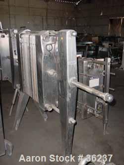 Used- APV Plate Heat Exchanger, Model HX, Stainless Steel. Approximately 70 square feet. (54) 9" wide x 34" long plates. 24-...