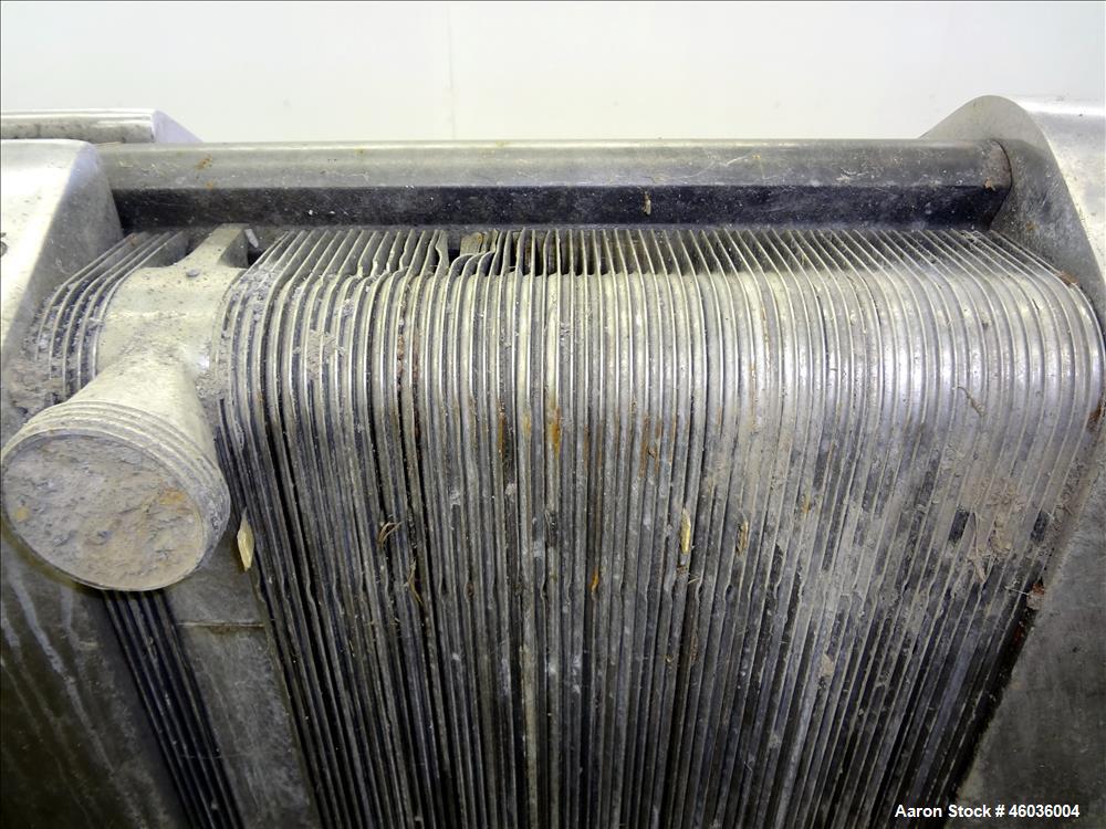 Used APV Paraflow Plate Heat Exchangers, Type HX, Approximte 130 square feet. (66) 32" Long x 9" wide 316 stainless steel plates. (8) 2" Diameter inlets/outlets, (1) divider. Serial# M/C 3551. No pre...