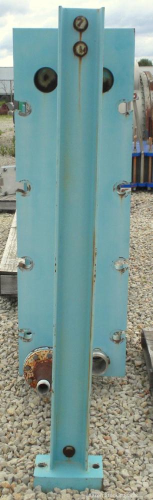 Used APV Plate Heat Exchanger, Approximately 878 Square Feet, Model R57, 316 Stainless Steel. (61) 16" wide x 60" tall plates, (2) 4-1/2" fittings, (2) 4" sanitary fittings. Mounted in a carbon steel...