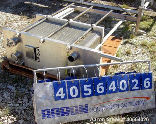 Used APV Plate Heat Exchanger, Model SR20,  stainless steel. Approximately 258 square feet. (155) approximate 12" wide x 32" long plates, rated 100 psi.  2 1/2" tri-clamp inlet/outlet. Expandable sta...