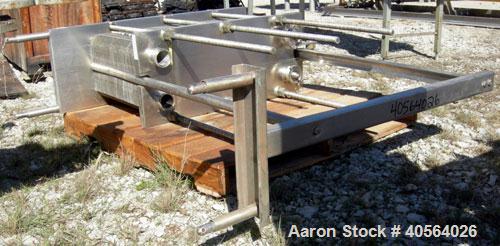 Used APV Plate Heat Exchanger, Model SR20,  stainless steel. Approximately 258 square feet. (155) approximate 12" wide x 32" long plates, rated 100 psi.  2 1/2" tri-clamp inlet/outlet. Expandable sta...