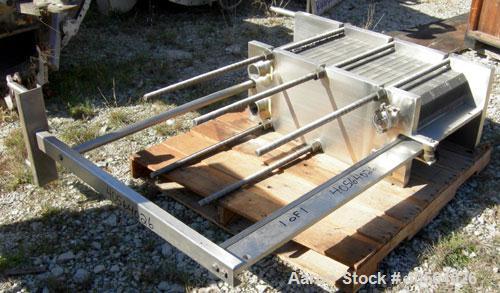 Used APV Plate Heat Exchanger, Model SR20,  stainless steel. Approximately 258 square feet. (155) approximate 12" wide x 32" long plates, rated 100 psi.  2 1/2" tri-clamp inlet/outlet. Expandable sta...