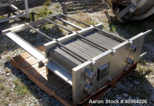 Used APV Plate Heat Exchanger, Model SR20,  stainless steel. Approximately 258 square feet. (155) approximate 12" wide x 32" long plates, rated 100 psi.  2 1/2" tri-clamp inlet/outlet. Expandable sta...