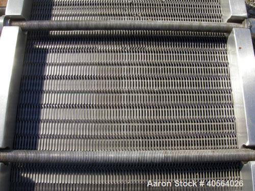 Used APV Plate Heat Exchanger, Model SR20,  stainless steel. Approximately 258 square feet. (155) approximate 12" wide x 32" long plates, rated 100 psi.  2 1/2" tri-clamp inlet/outlet. Expandable sta...