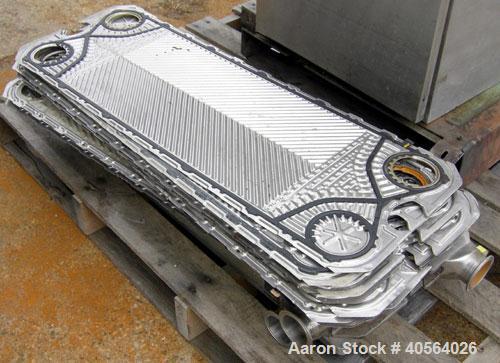 Used APV Plate Heat Exchanger, Model SR20,  stainless steel. Approximately 258 square feet. (155) approximate 12" wide x 32" long plates, rated 100 psi.  2 1/2" tri-clamp inlet/outlet. Expandable sta...