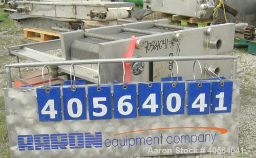 Used APV Plate Heat Exchanger, Model SR20, 304 stainless steel. Approximately 215 square feet. (129) approximate 12" wide x 32" long plates, rated 100 psi.  2 1/2" tri-clamp inlet/outlet. Expandable ...