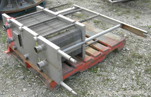Used APV Plate Heat Exchanger, Model SR20, 304 stainless steel. Approximately 215 square feet. (129) approximate 12" wide x 32" long plates, rated 100 psi.  2 1/2" tri-clamp inlet/outlet. Expandable ...