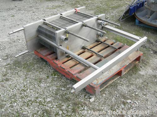 Used APV Plate Heat Exchanger, Model SR20, 304 stainless steel. Approximately 215 square feet. (129) approximate 12" wide x 32" long plates, rated 100 psi.  2 1/2" tri-clamp inlet/outlet. Expandable ...