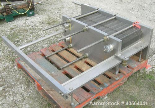 Used APV Plate Heat Exchanger, Model SR20, 304 stainless steel. Approximately 215 square feet. (129) approximate 12" wide x 32" long plates, rated 100 psi.  2 1/2" tri-clamp inlet/outlet. Expandable ...